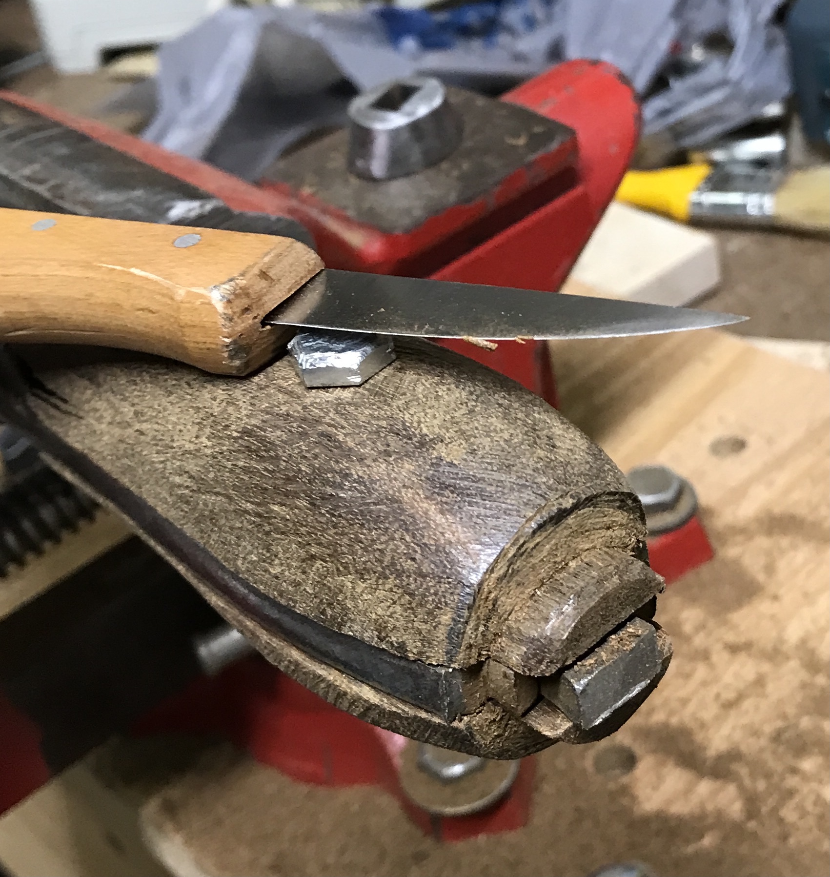 Trimming the handle end to fit in the cap